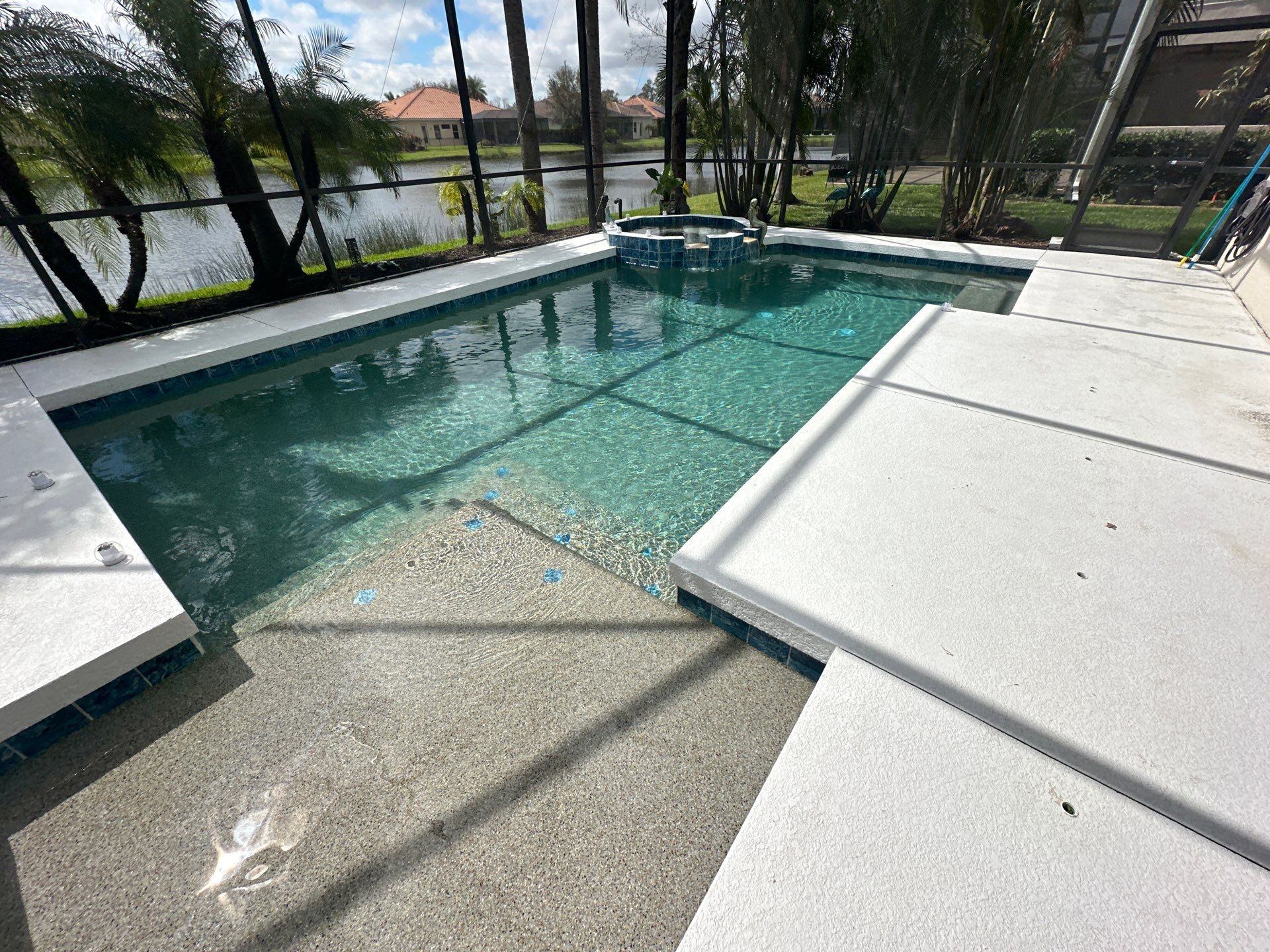 Before and after pool renovation in Sarasota FL with Aquabella Grand Central, Luv Tile, Royal Beige Marble coping, and Flagstone Cream/Beige pavers by Nelson Pool Company — before