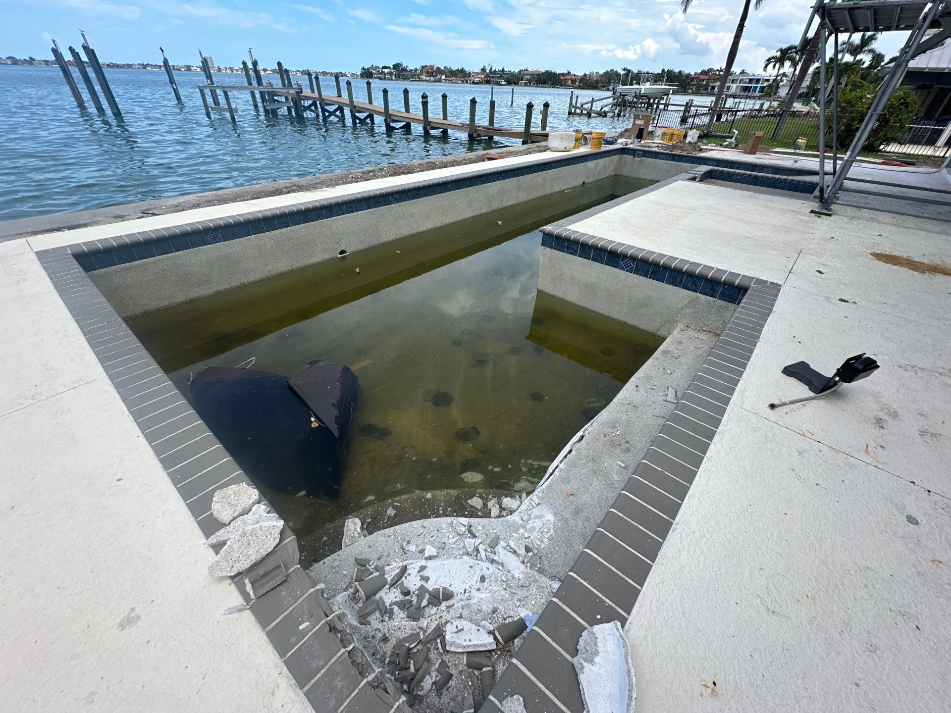 Before and after pool renovation in Sarasota FL with Pebble Tec Aqua Essence by Nelson Pool Company — before