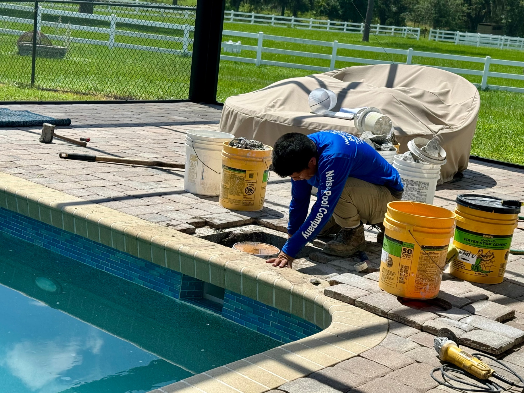 Nelson Pool Company technician performing a pool equipment repair in Southwest Florida