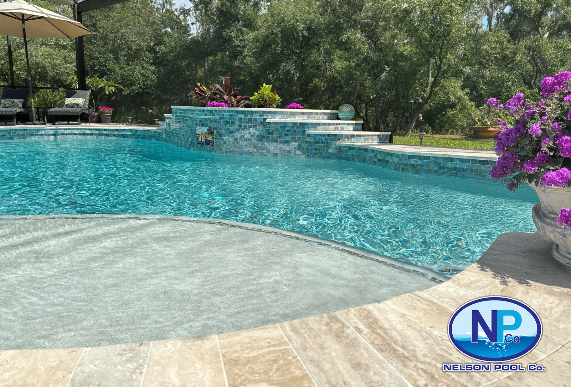 Pool Remodel with Glass Tile Wall & Travertine Deck in Lakewood Ranch — Nelson Pool Company