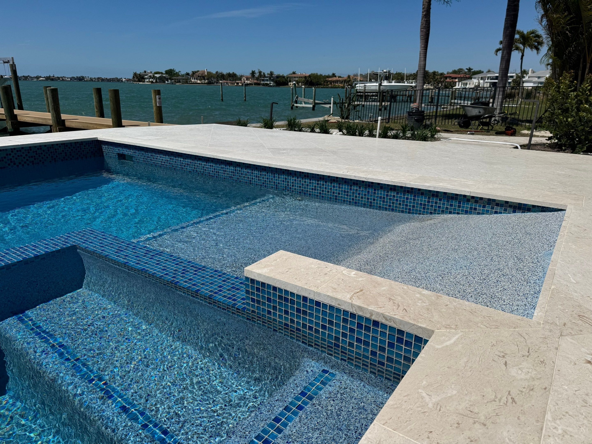 Sarasota Pool Renovation with Blue Glass Tile & Marble Coping in Sarasota — Nelson Pool Company