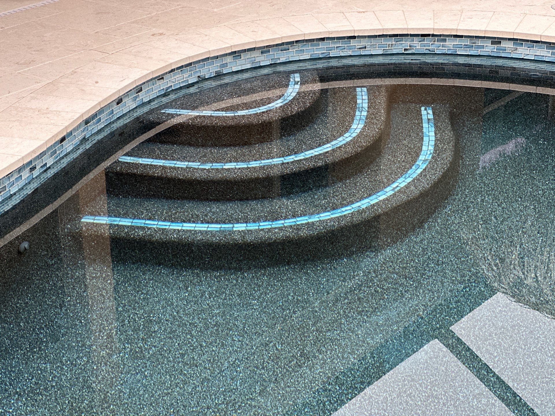 Parrish Pool Resurfacing with Blue Glass Tile Step Accents in Parrish — Nelson Pool Company