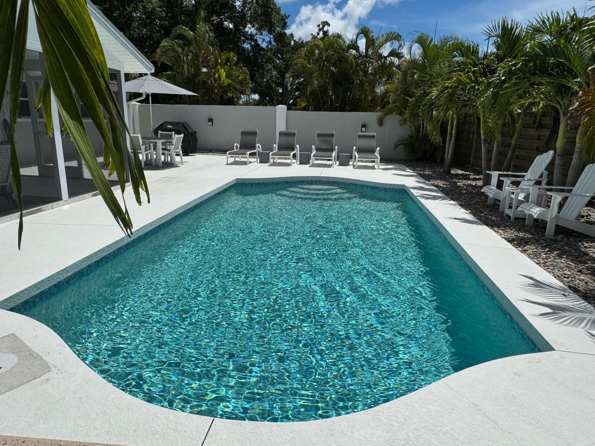 Sarasota Pool Remodel with Glass Tile Interior & Deck Coating in Sarasota — Nelson Pool Company