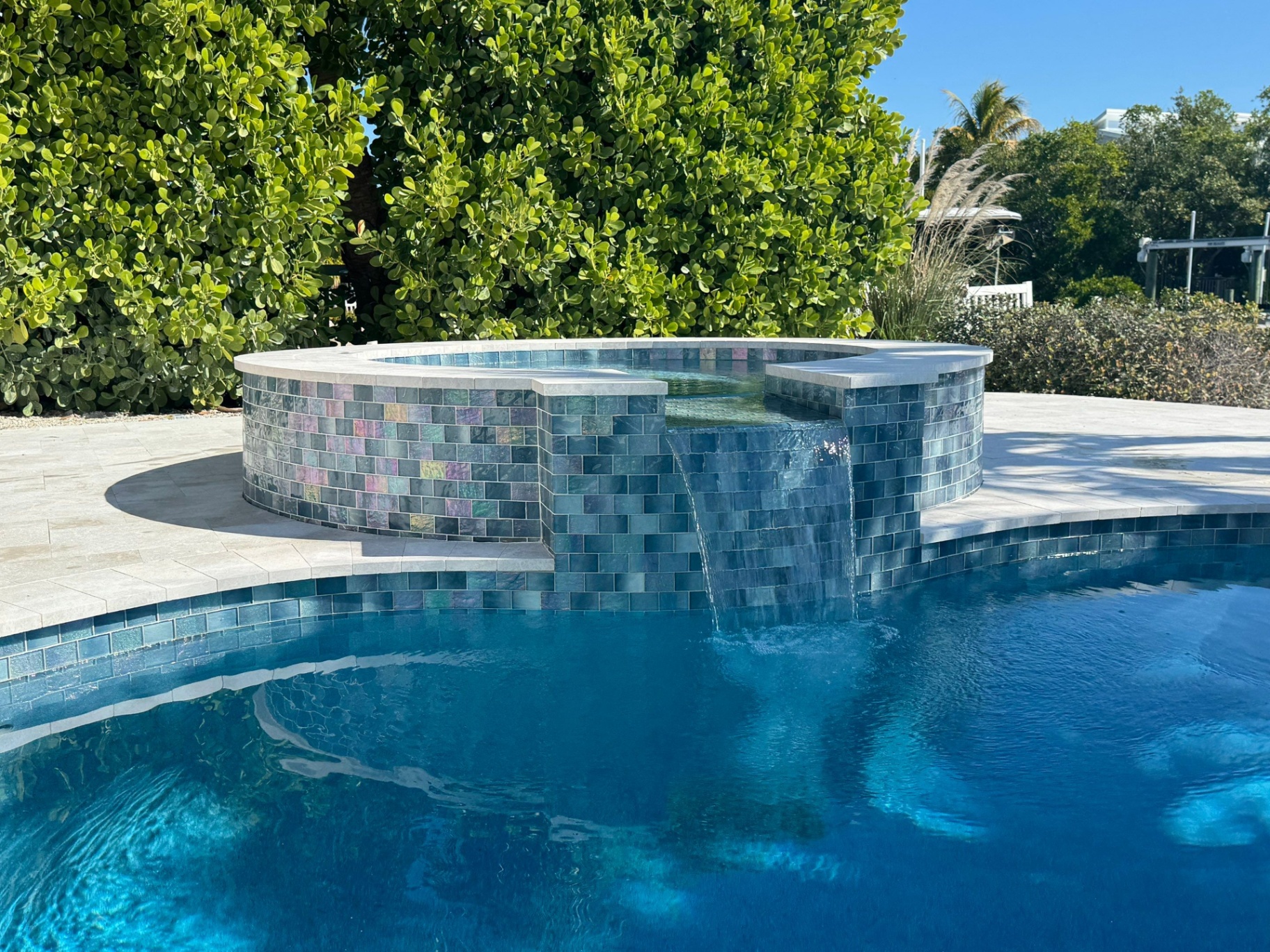 Spa Remodel with Glass Tile & Waterfall Spillway in Holmes Beach — Nelson Pool Company