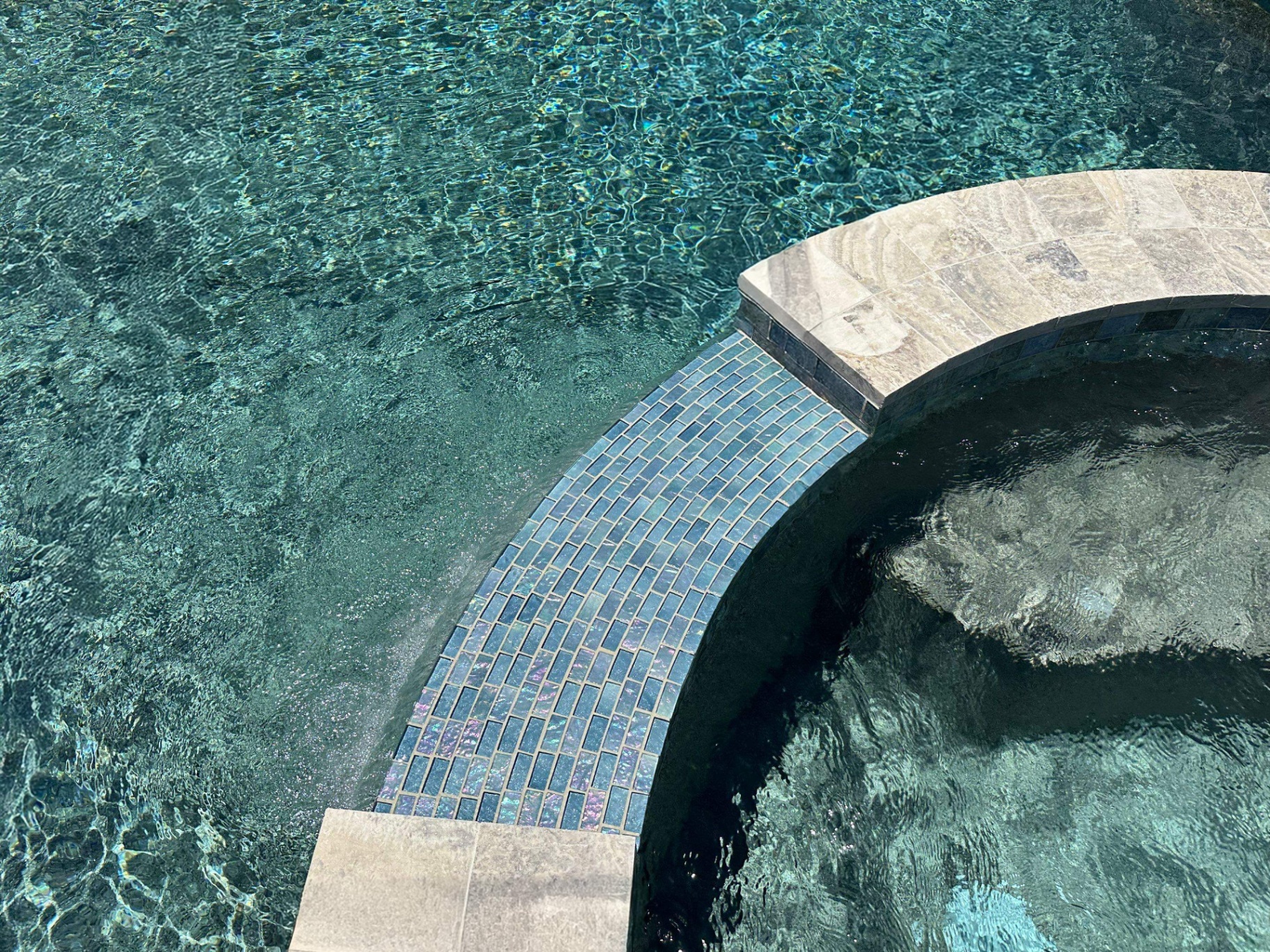 Sarasota Spa Renovation with Iridescent Glass Spillway Tile in Sarasota — Nelson Pool Company