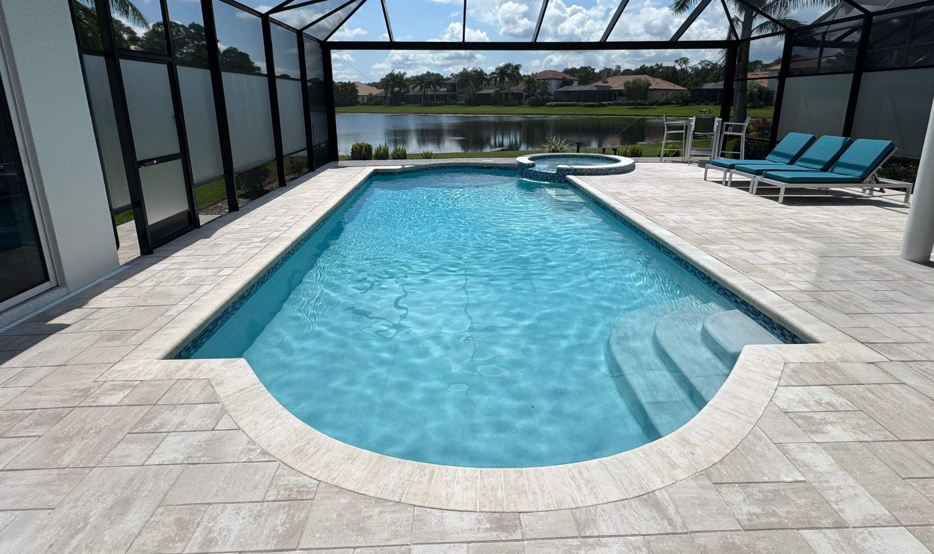 Before and after pool remodel in Bradenton FL with Luv Tile, Marquis PMM Quartz Surface, and Royal Beige Marble pavers by Nelson Pool Company — after