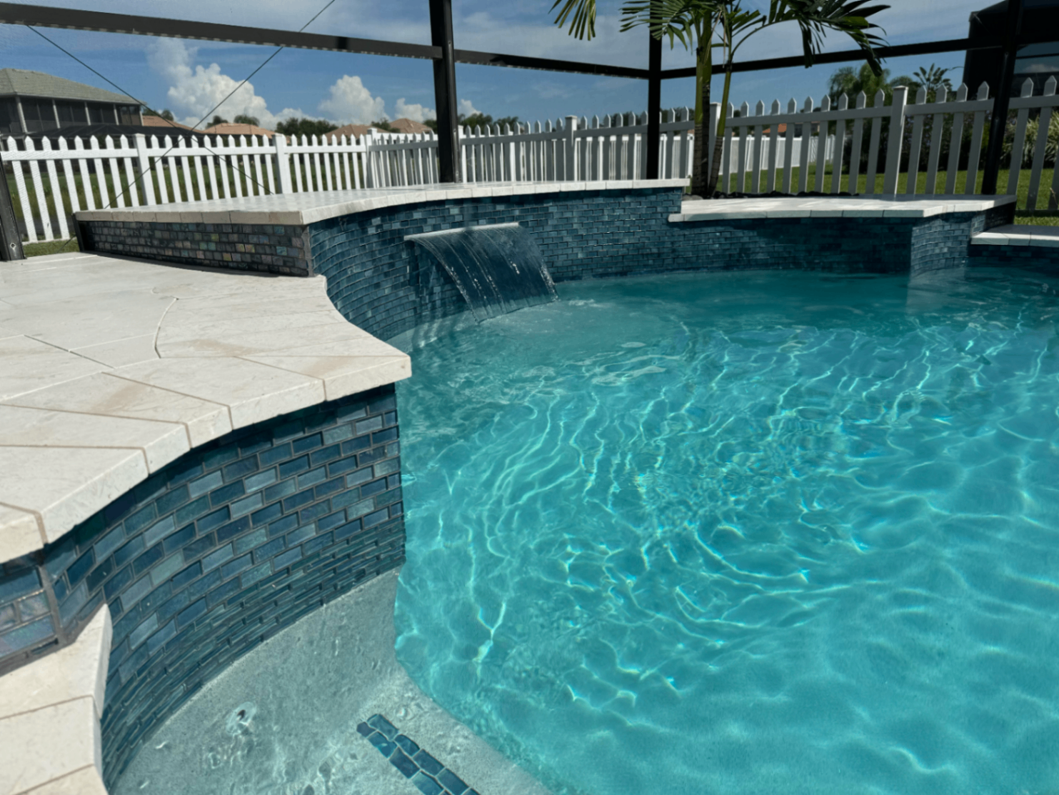 Wellen Park Pool Remodel with Raised Wall, Waterfall & Marble Deck in Wellen Park — Nelson Pool Company