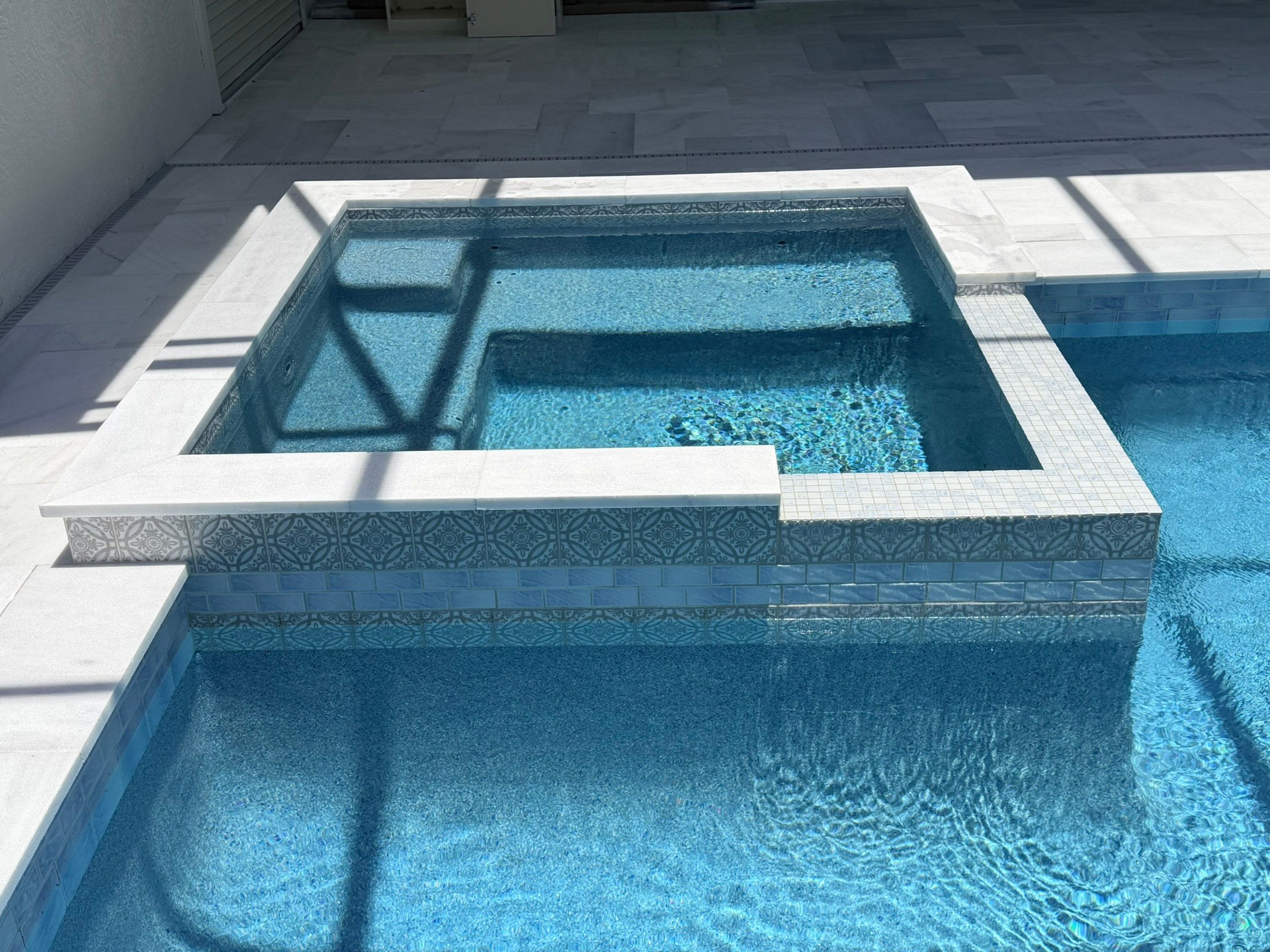 Lakewood Ranch Spa Remodel with Pattern Tile & Spillover Spa in Lakewood Ranch — Nelson Pool Company