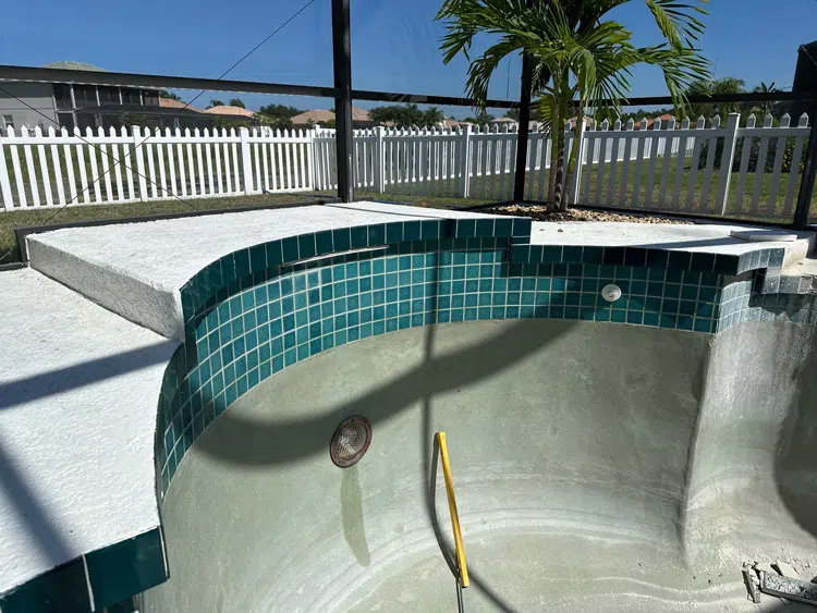 Before and after pool and waterfall renovation in Bradenton FL — before