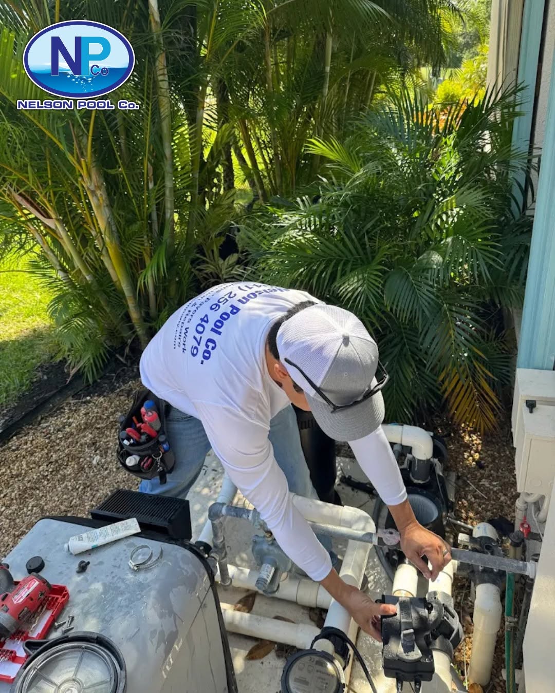 Nelson Pool Company technician repairing pool equipment