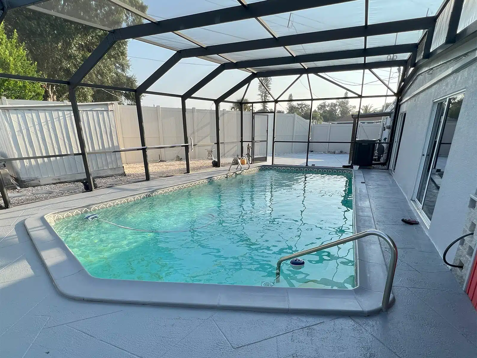 Before and after pool resurfacing and paver deck transformation in Bradenton FL — before