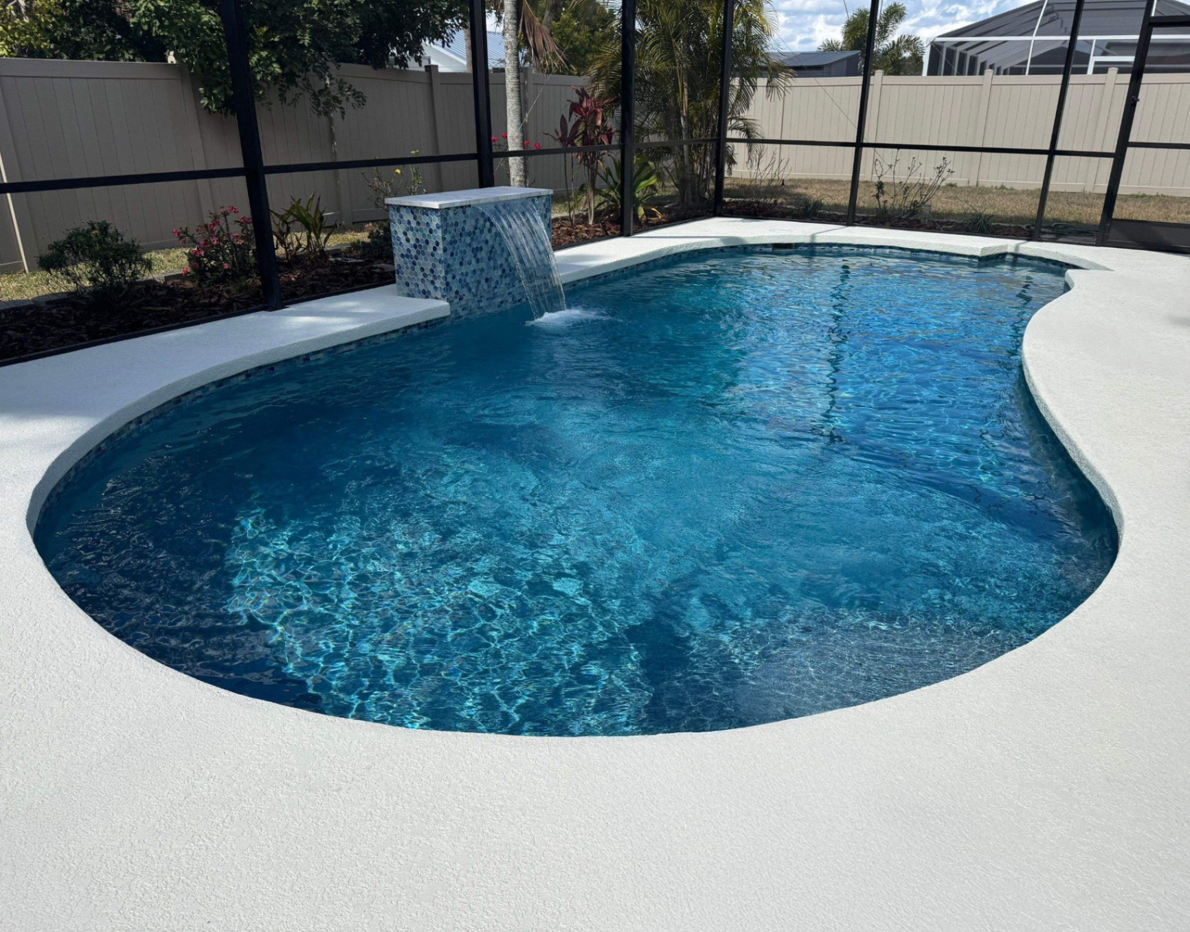 Sarasota Pool Resurfacing with Mosaic Waterfall & Deck Coating in Sarasota — Nelson Pool Company
