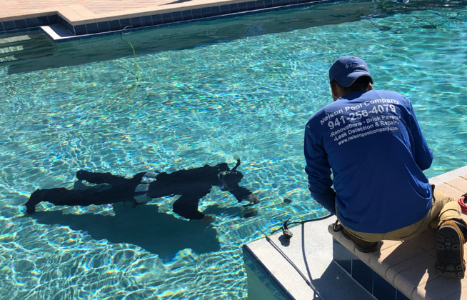 Nelson Pool Company technician detecting a pool leak