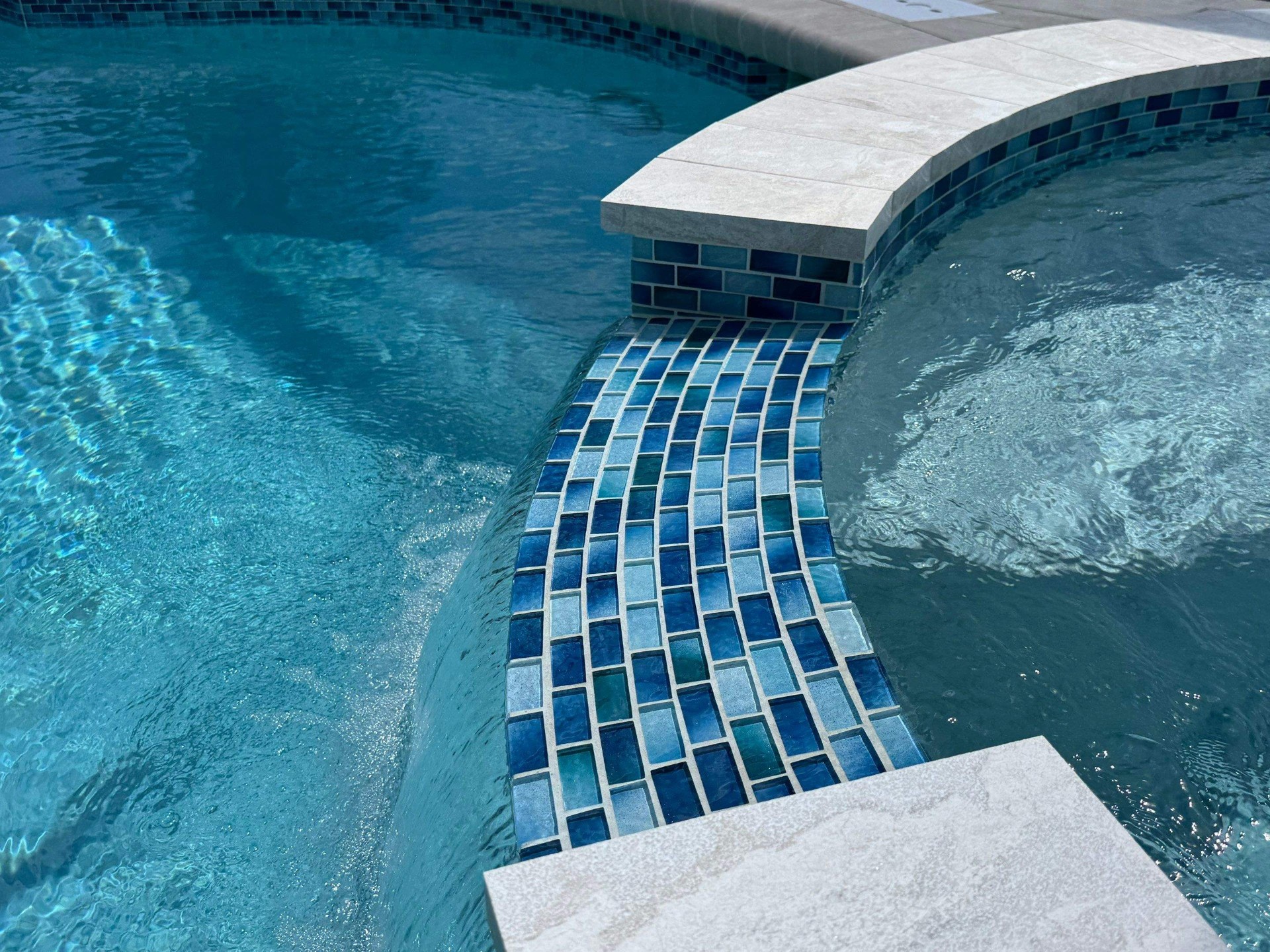 Pool & Raised Spa Renovation with Glass Tile Spillway in Bradenton — Nelson Pool Company