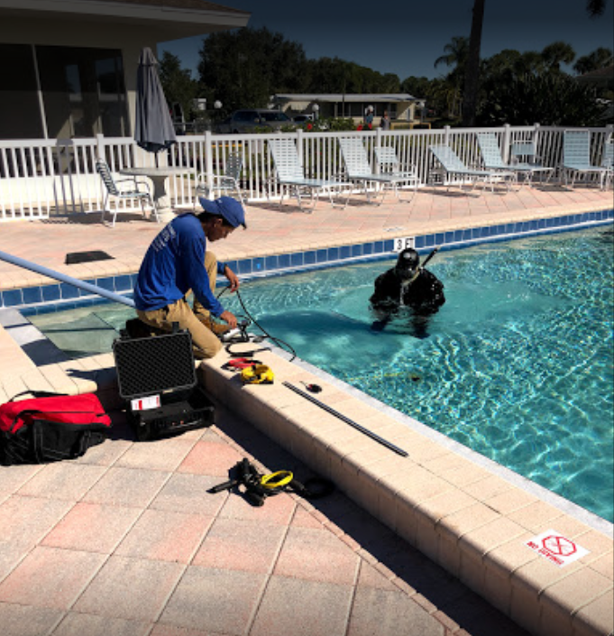 Nelson Pool Company divers performing an underwater pool leak inspection