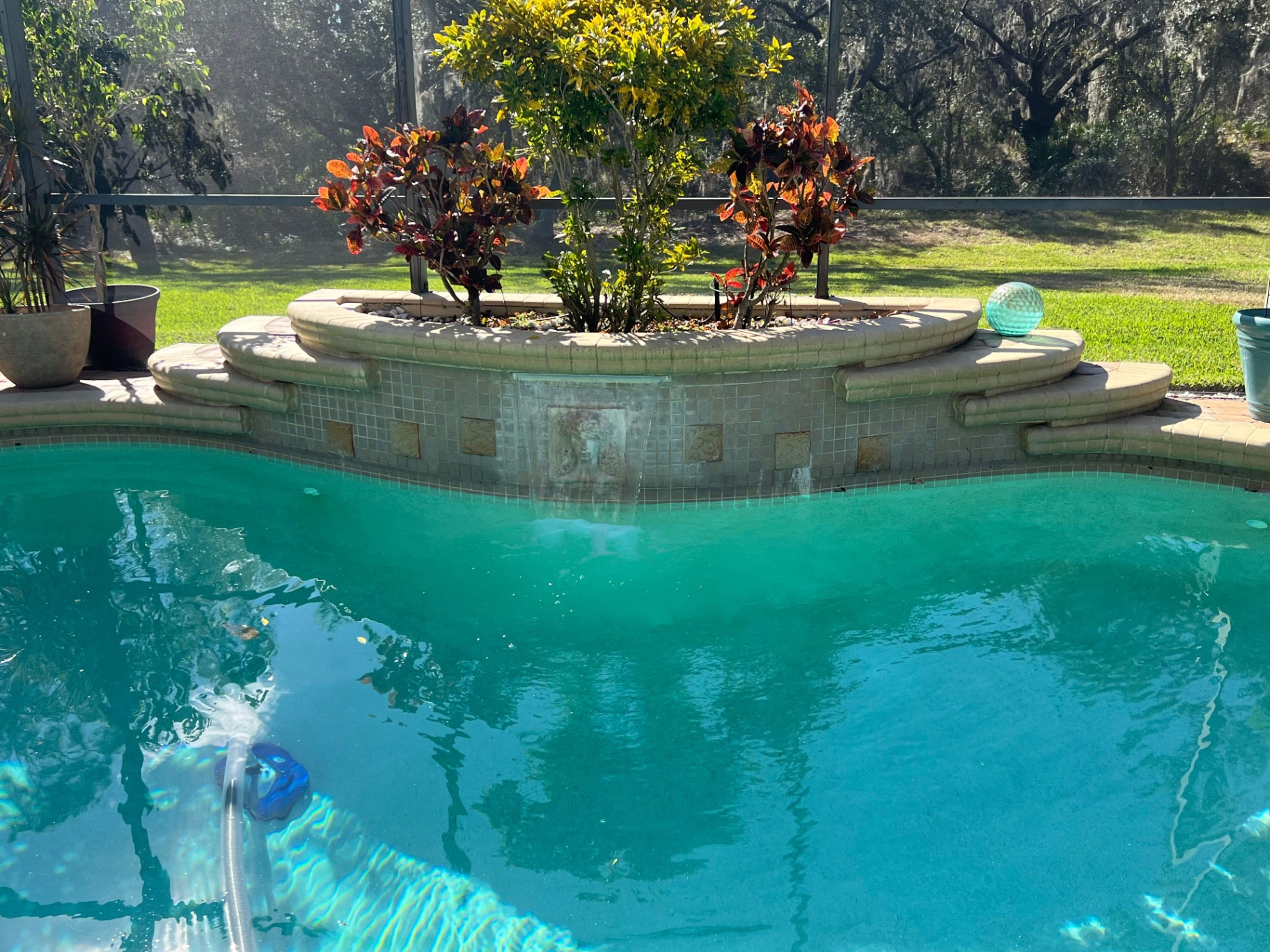 Before and after pool renovation in Lakewood Ranch FL with StoneScapes Aqua Cool and Luv Tile by Nelson Pool Company — before