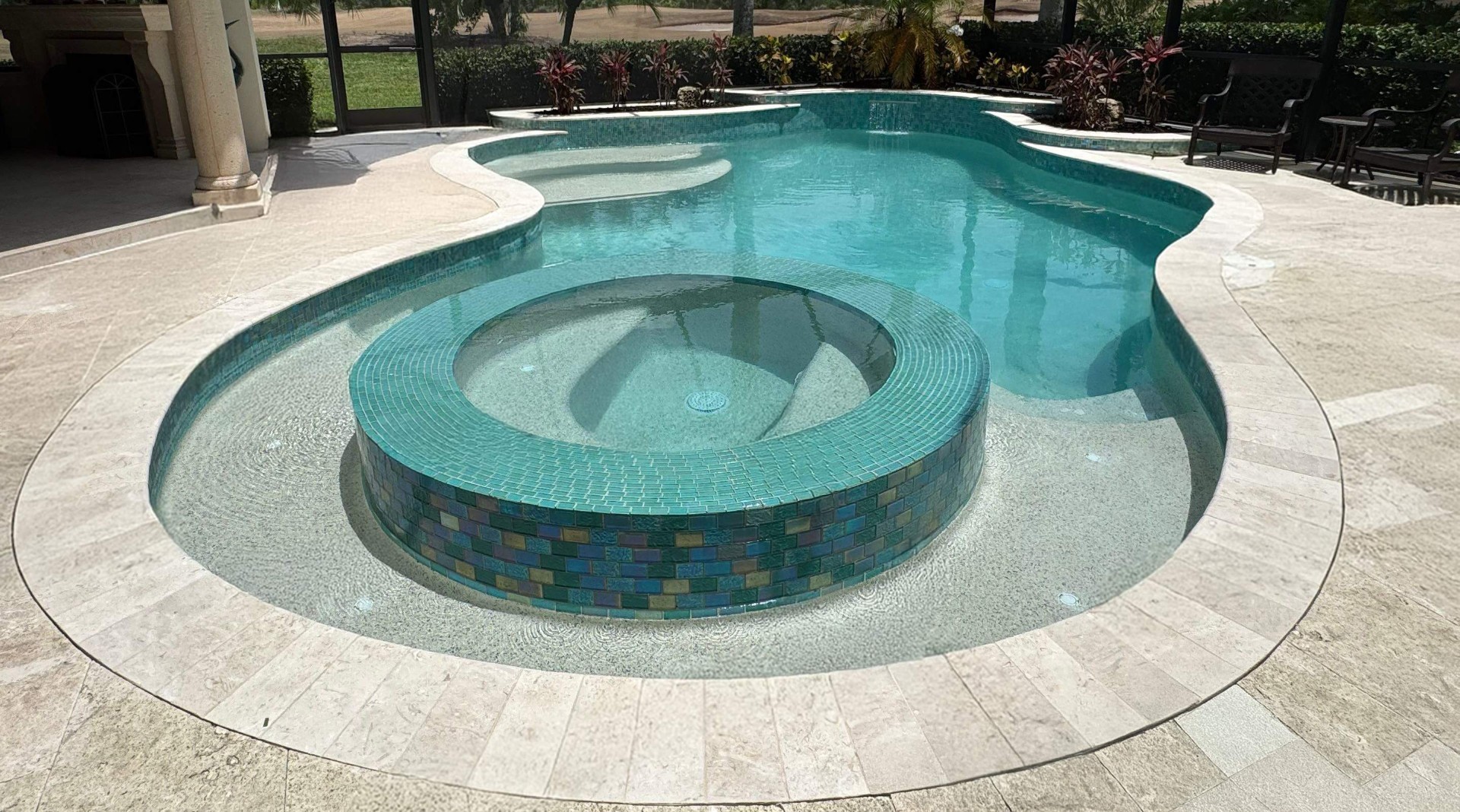 Freeform Pool & Spa Renovation with Glass Tile & Travertine Deck in Lakewood Ranch — Nelson Pool Company
