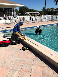 Nelson Pool Company technician performing a targeted pool leak repair