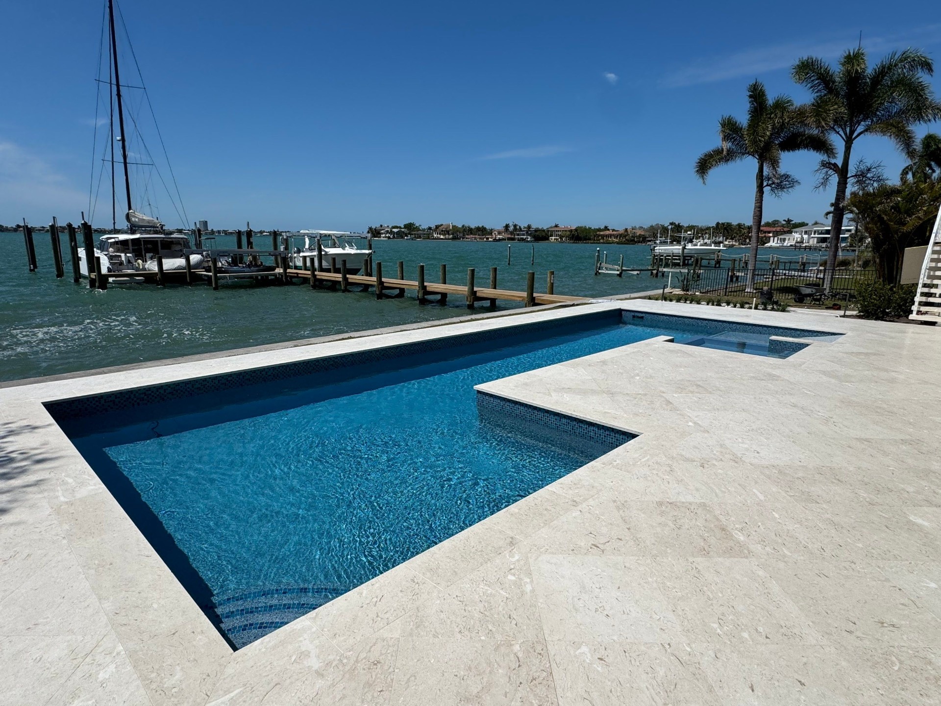 Before and after pool renovation in Sarasota FL with Pebble Tec Aqua Essence by Nelson Pool Company — after