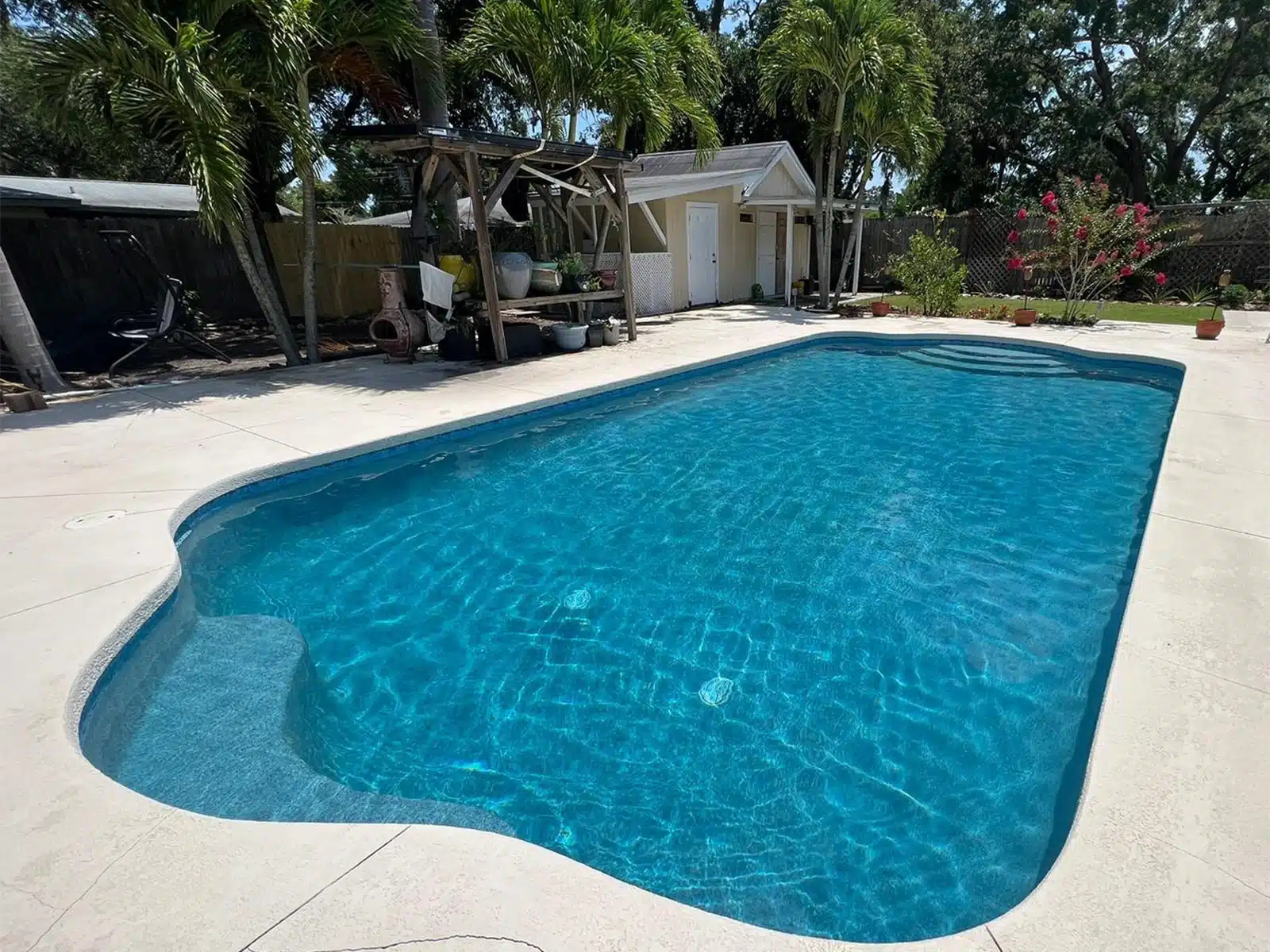 Before and after pool remodel with tile coping and pavers in Sarasota FL — after