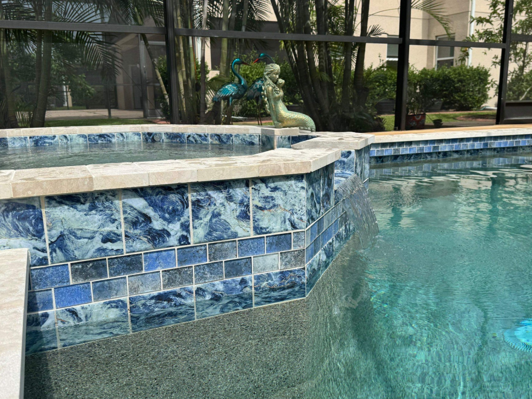Sarasota Spa Renovation with Blue Onyx Glass Tile & Travertine Coping in Sarasota — Nelson Pool Company
