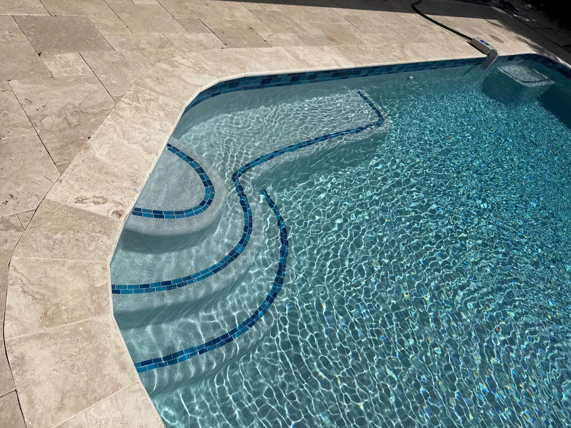 Before and after pool resurfacing in Holmes Beach FL with NPT Peacock and Marquis PMM Bluestone Quartz by Nelson Pool Company — before