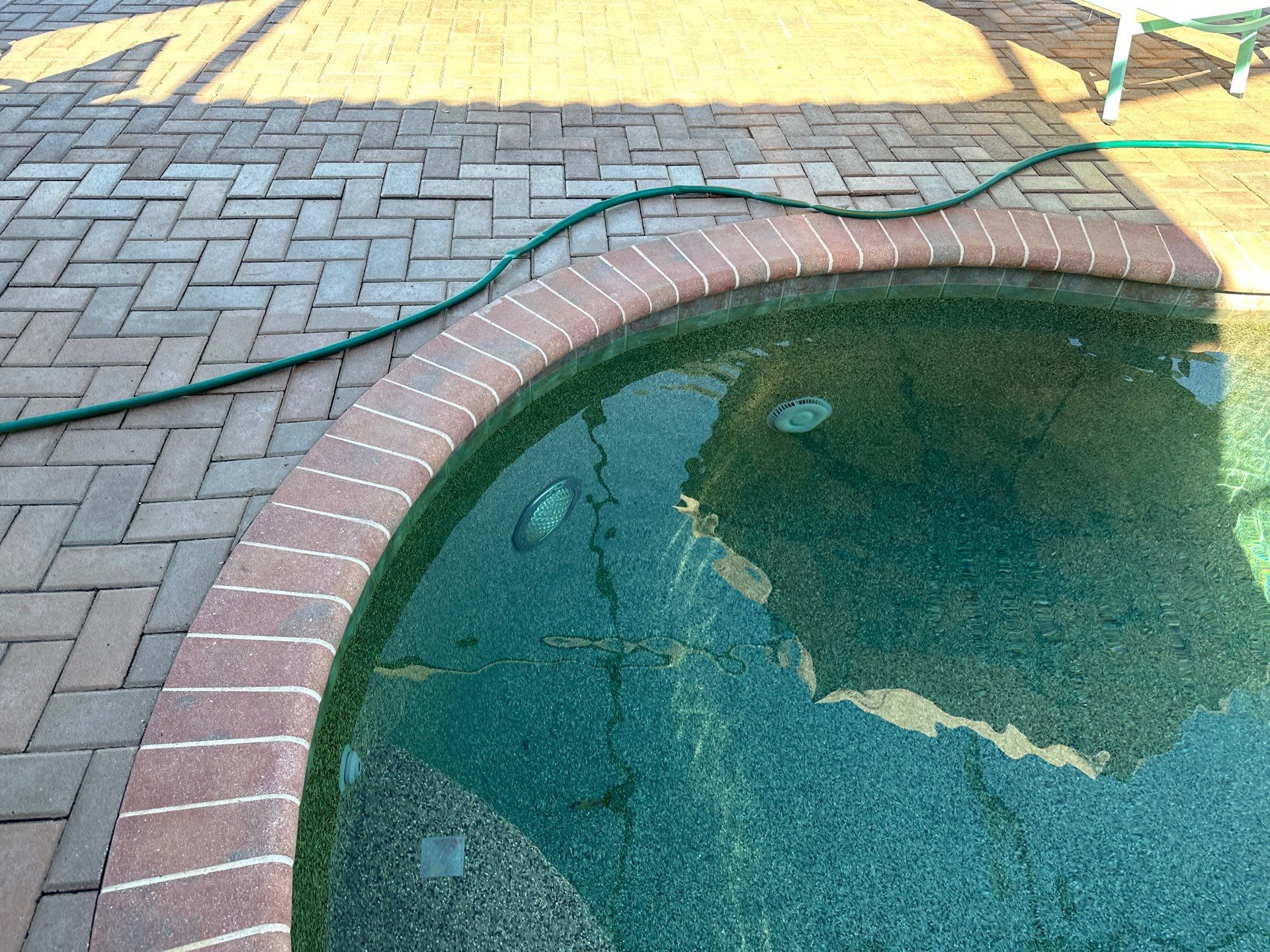 Before and after pool resurfacing in Anna Maria FL with Alaskan Silver Travertine and Luv Tile by Nelson Pool Company — before