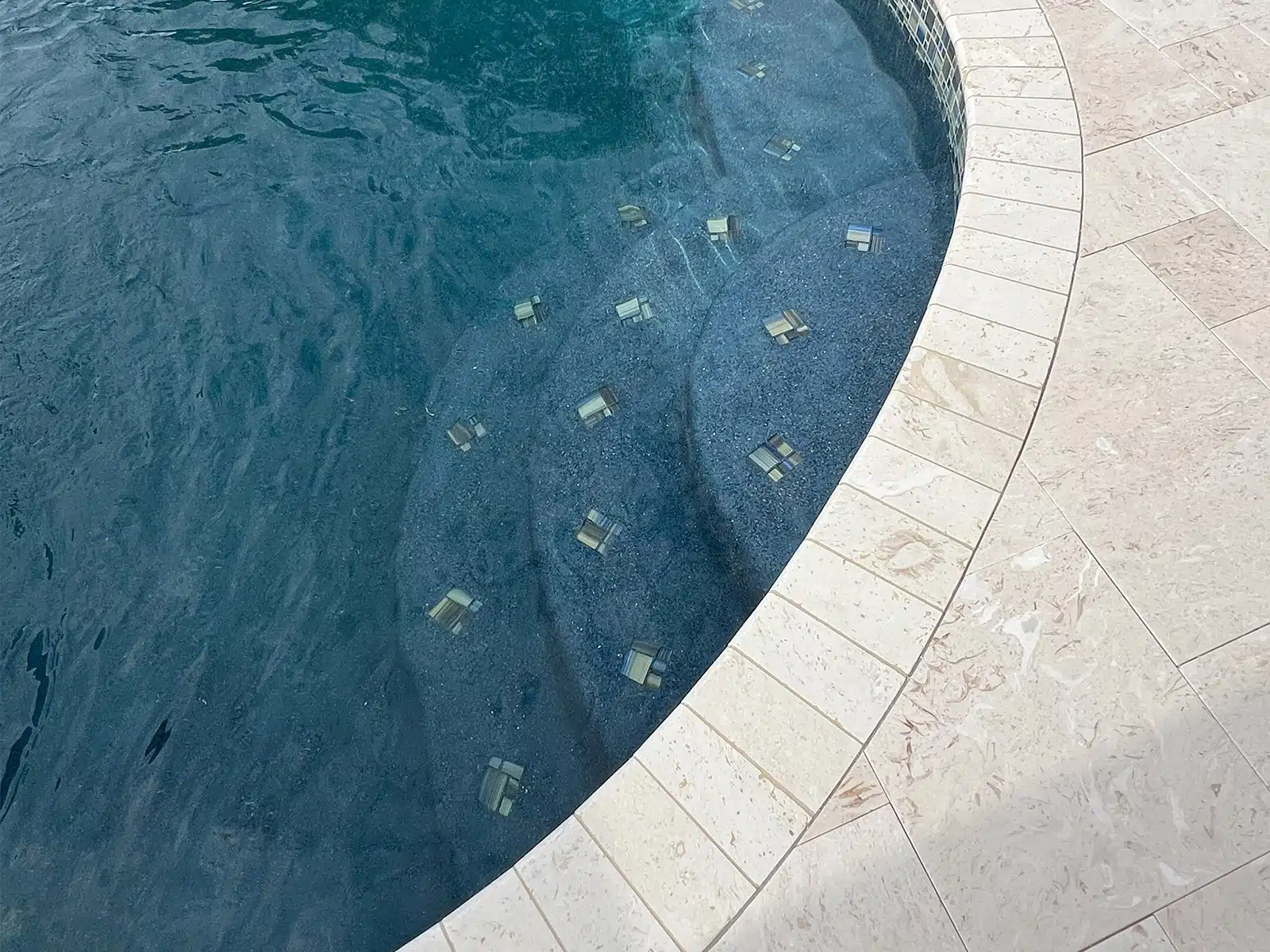 Before and after pool renovation with new tile and coping in Sarasota FL — after