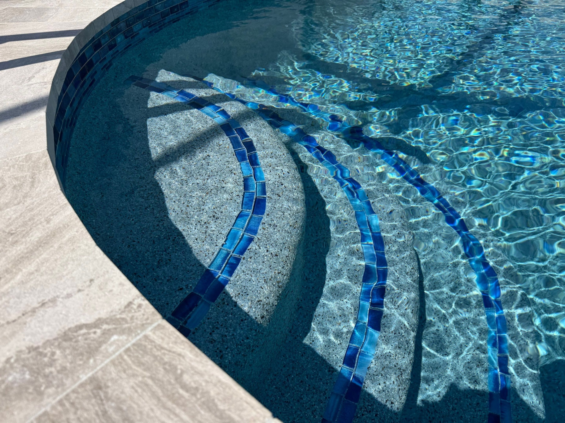 Sarasota Pool Resurfacing with Curved Steps & Glass Tile in Sarasota — Nelson Pool Company
