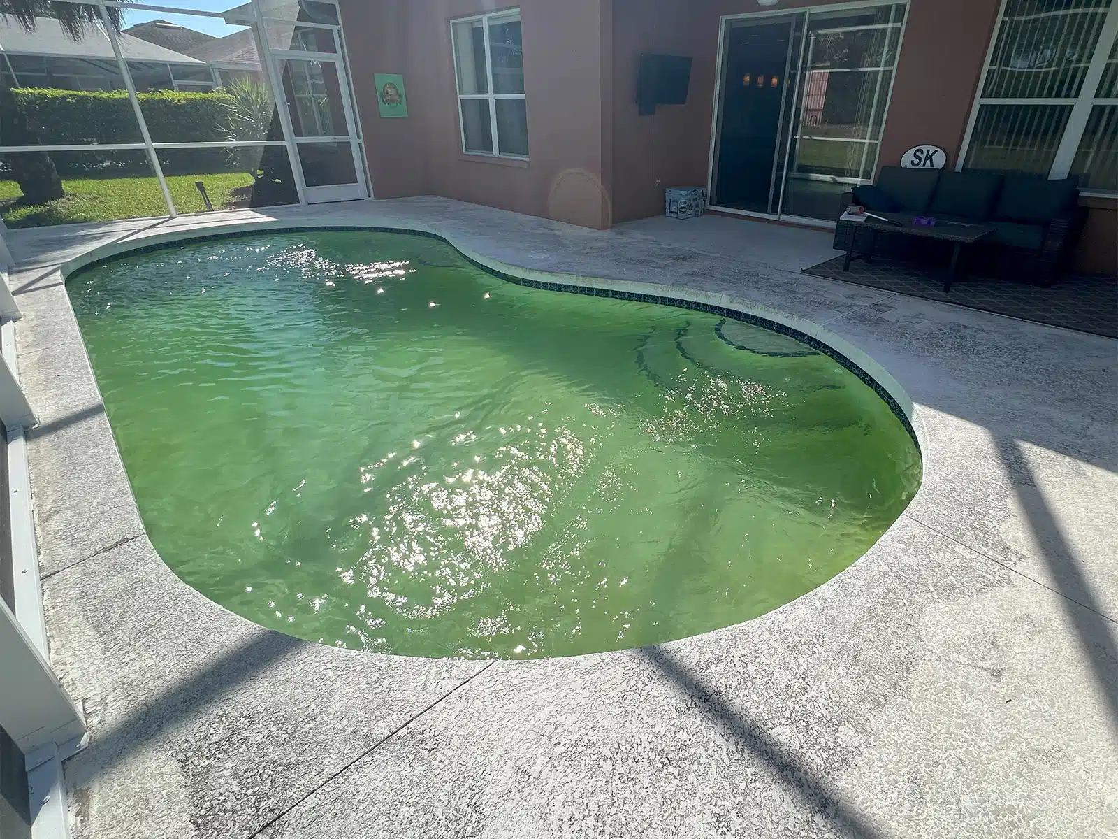 Before and after pool renovation in Sarasota FL by Nelson Pool Company — before
