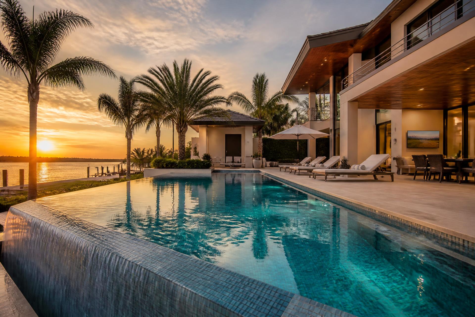 Luxury Florida backyard pool at sunset built by Nelson Pool Company